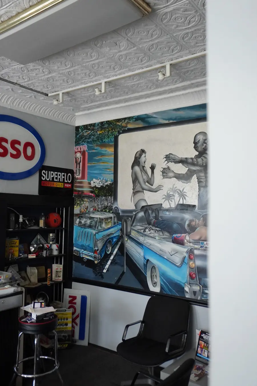 Waiting area with a vintage car mural